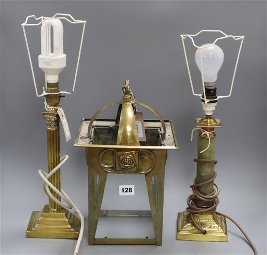 An Art Nouveau design brass hall lantern, a brass corinthian column table lamp and a brass and onyx table lamp